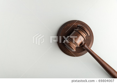 Wooden judge gavel and sound Board on white background. Top view. Auction. Symbol of justice and trial Wooden judge gavel and sound Board on white background. Top view. Auction. Symbol of justice and trial 69804007