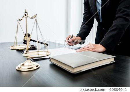 Professional women lawyers work at a law office There are scales, Scales of justice, judges gavel, and litigation documents. Concepts of law and justice Professional women lawyers work at a law office There are scales, Scales of justice, judges gavel, and litigation documents. Concepts of law and justice 69804041