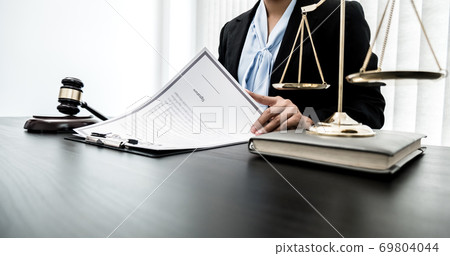 Professional women lawyers work at a law office There are scales, Scales of justice, judges gavel, and litigation documents. Concepts of law and justice Professional women lawyers work at a law office There are scales, Scales of justice, judges gavel, and litigation documents. Concepts of law and justice 69804044