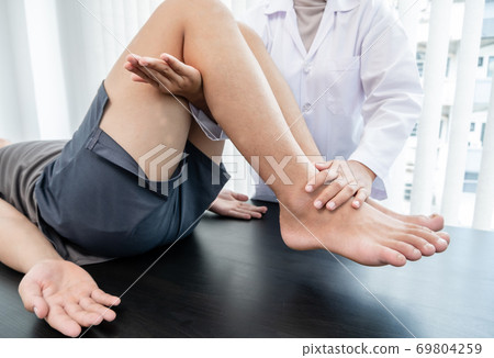 Male patients consulted physiotherapists with knee pain problems for examination and treatment. Rehabilitation physiotherapy concept 69804259