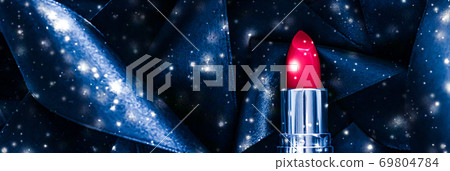 Red lipstick on blue silk and shiny glitter background, luxury make-up and beauty cosmetic Red lipstick on blue silk and shiny glitter background, luxury make-up and beauty cosmetic 69804784