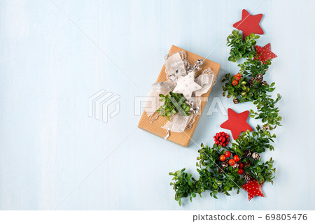 Rustic wooden blue background with Christmas gift. 69805476