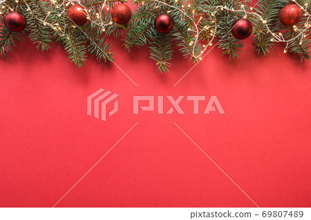 Christmas frame with evergreen branches, garland. 69807489