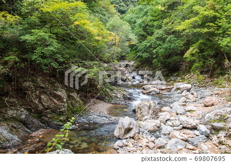 Beautiful Mizufuji Kawachi Valley flowing through the clear stream Kuwabara River Beautiful Mizufuji Kawachi Valley flowing through the clear stream Kuwabara River 69807695