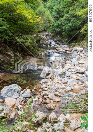 Beautiful Mizufuji Kawachi Valley flowing through the clear stream Kuwabara River Beautiful Mizufuji Kawachi Valley flowing through the clear stream Kuwabara River 69807696