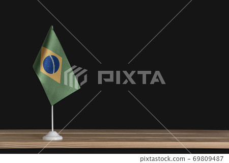 Flag pole. National table flag of Brazil on black background. 69809487