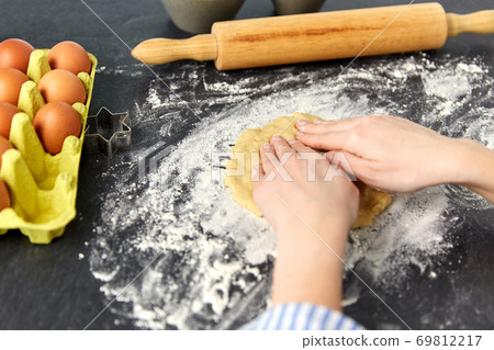 hands making shortcrust pastry dough on table hands making shortcrust pastry dough on table 69812217
