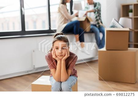 sad girl moving to new home with her family sad girl moving to new home with her family 69812275