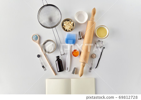 recipe book and cooking ingredients on table 69812728