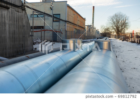 outdoor pipeline and old hangar in winter outdoor pipeline and old hangar in winter 69812792