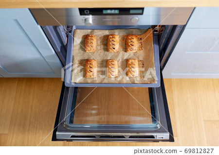 baking tray with jam pies in oven at home kitchen baking tray with jam pies in oven at home kitchen 69812827