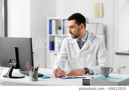 doctor with clipboard and computer at hospital 69812828