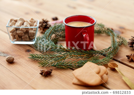 cup of eggnog, fir branches, gingerbread and sugar 69812833