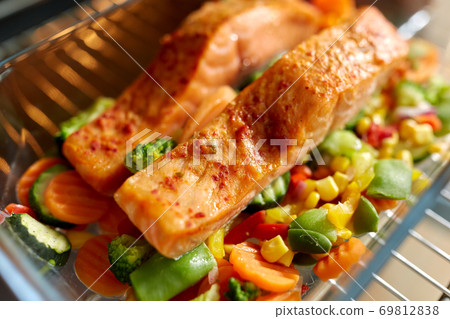 food cooking in baking dish in oven at home 69812838