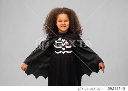 girl in costume of dracula with cape on halloween girl in costume of dracula with cape on halloween 69813540