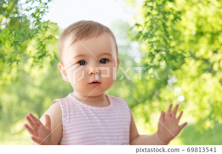 portrait of little baby girl over nature portrait of little baby girl over nature 69813541