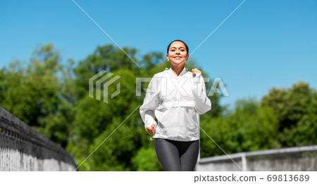 african american woman running outdoors african american woman running outdoors 69813689