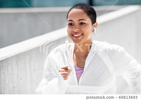 african american woman running upstairs outdoors african american woman running upstairs outdoors 69813693