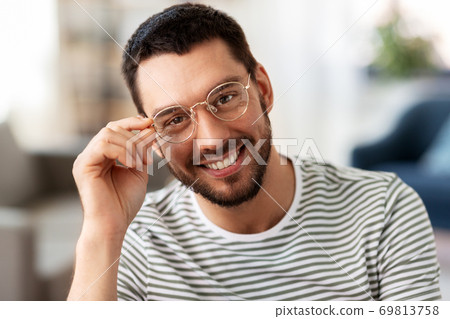 portrait of happy smiling man in glasses at home portrait of happy smiling man in glasses at home 69813758