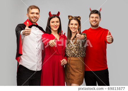 happy friends in halloween costumes snow thumbs up happy friends in halloween costumes snow thumbs up 69813877