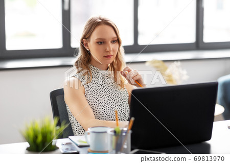 businesswoman with laptop working at office 69813970