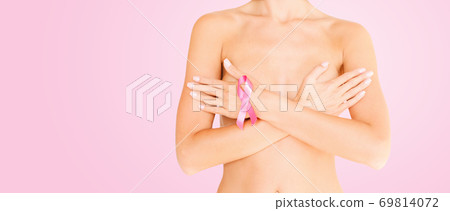 woman with pink breast cancer awareness ribbon woman with pink breast cancer awareness ribbon 69814072