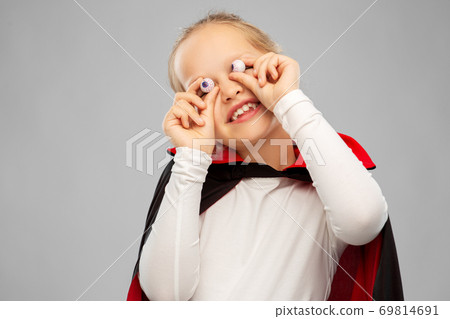 girl in halloween costume of dracula with eyeballs girl in halloween costume of dracula with eyeballs 69814691