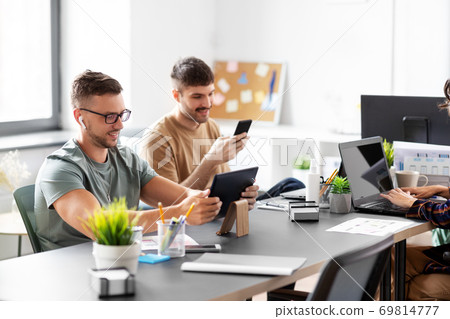 business team or startuppers working at office business team or startuppers working at office 69814777