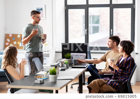 team of startuppers drinking coffee at office team of startuppers drinking coffee at office 69815005