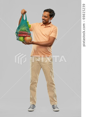 happy indian man with food in reusable net tote happy indian man with food in reusable net tote 69815239