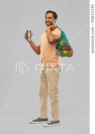 man with food in bag and tumbler or thermo cup 69815240