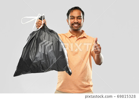 happy indian man with trash bag showing thumbs up happy indian man with trash bag showing thumbs up 69815328