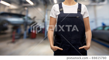 close up of female worker at car service 69815780
