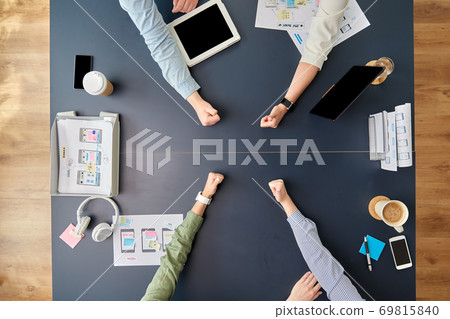 business team showing thumbs up at office table business team showing thumbs up at office table 69815840