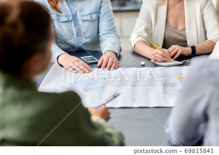 business team with blueprint working at office business team with blueprint working at office 69815841
