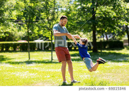 happy father with son playing in summer park 69815846