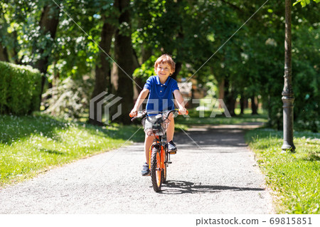 little boy riding bike
