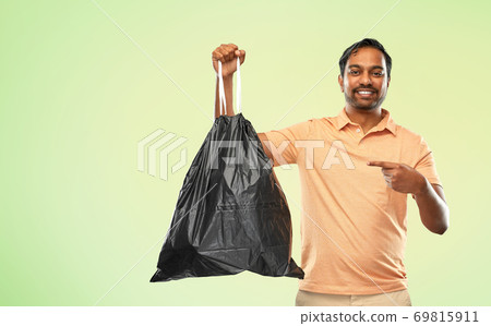 smiling indian man holding trash bag smiling indian man holding trash bag 69815911