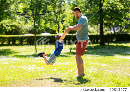 happy father with son playing in summer park happy father with son playing in summer park 69815977