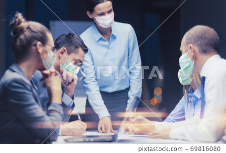 female boss in mask with business team at office female boss in mask with business team at office 69816080