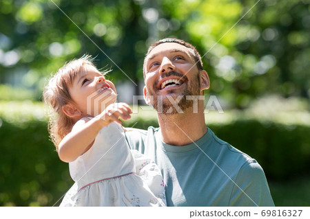 happy father with baby daughter at summer park 69816327