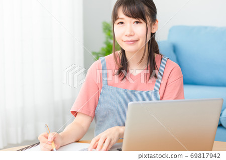 Woman keeping household account book photo material Woman keeping household account book photo material 69817942