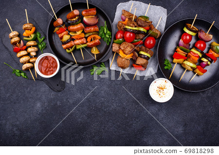 Grilled kebabs with meat, mushrooms and vegetables Grilled kebabs with meat, mushrooms and vegetables 69818298