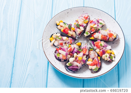 Traditional  Peruvian food background with mussels 69819720
