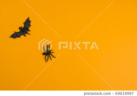 Bats on an orange background. Halloween decor Bats on an orange background. Halloween decor 69819997