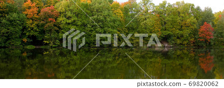 Evening lakeside landscape with autumn colorful trees Evening lakeside landscape with autumn colorful trees 69820062