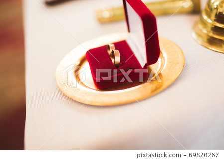 Two golden wedding rings isolated background concept Two golden wedding rings isolated background concept 69820267