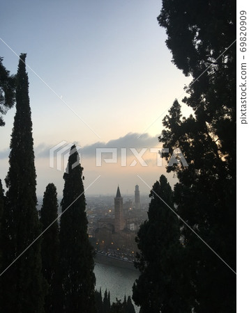 Medieval European streets through the gaps in the trees 69820909