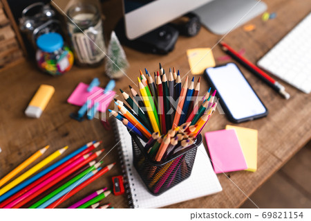 Desk Stationery on the desk, colored books and toys. Desk Stationery on the desk, colored books and toys. 69821154