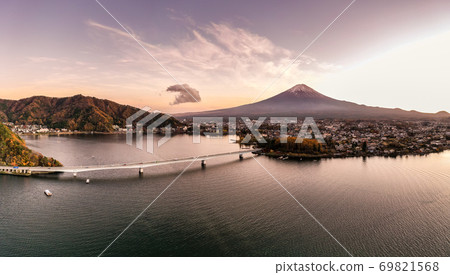 Aerial view over lake Kawaguchi, located in the border Fujikawaguchiko and Minobu, southern Yamanashi Prefecture near Mount Fuji, Japan. Lake Kawaguchi is a very popular tourist spot near Fuji Japan. Aerial view over lake Kawaguchi, located in the border Fujikawaguchiko and Minobu, southern Yamanashi Prefecture near Mount Fuji, Japan. Lake Kawaguchi is a very popular tourist spot near Fuji Japan. 69821568